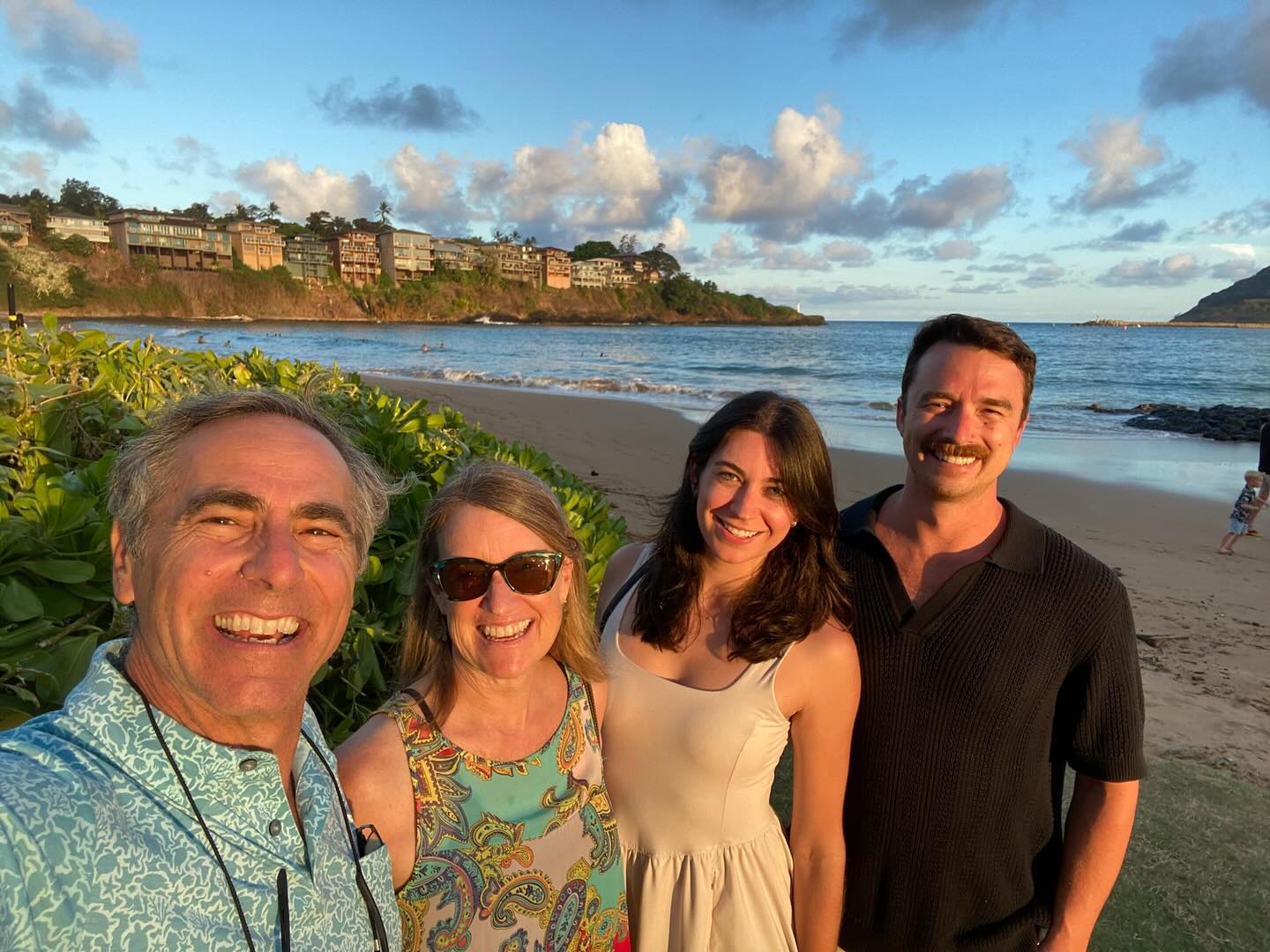 The You Bettah Rum family on a Kaua‘i beach at sunset